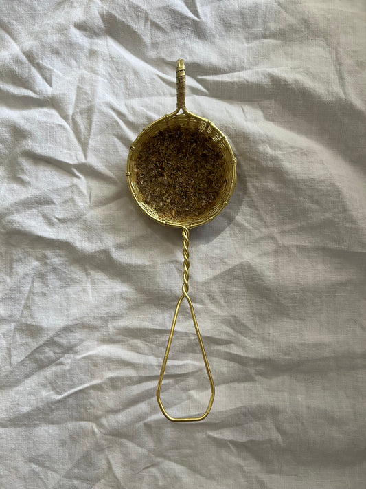 Woven brass tea strainer
