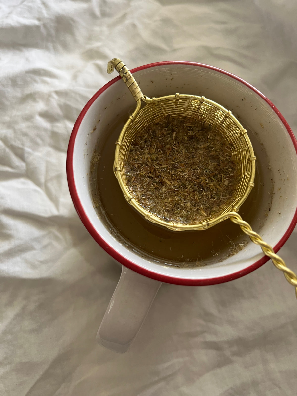 Woven brass tea strainer